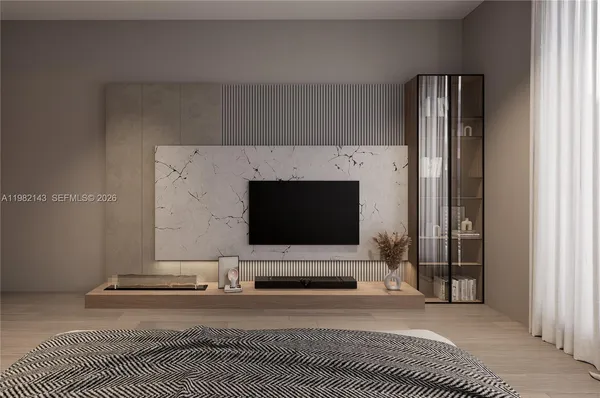 a living room with a flat screen tv and a fireplace