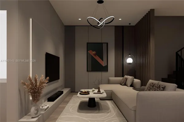 a living room with furniture and a flat screen tv