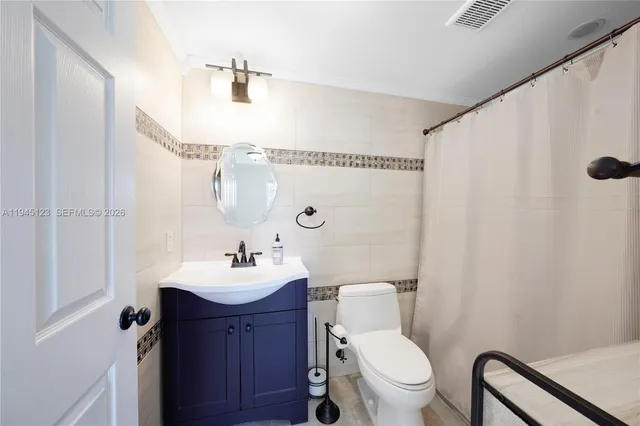 a bathroom with a shower and a tub