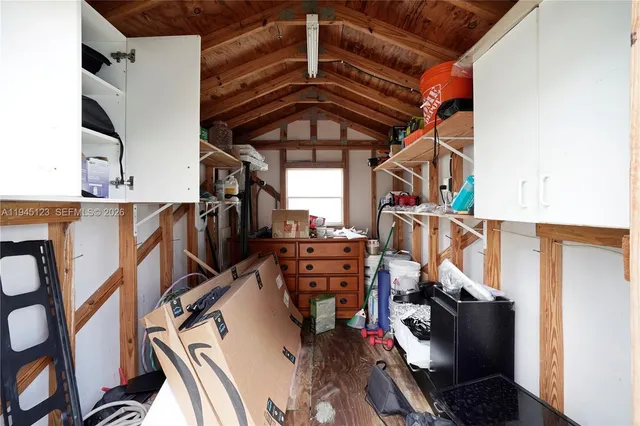 a view of a house with a backyard and sitting area