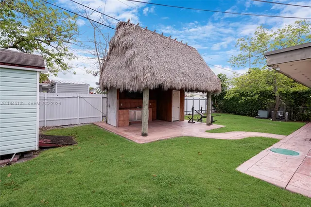 a view of a pathway both side of the house