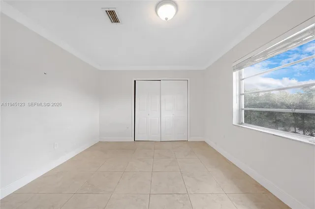 a view of an empty room and window