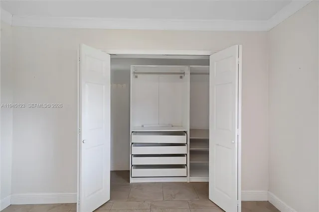 a bathroom with a sink a shower and a mirror