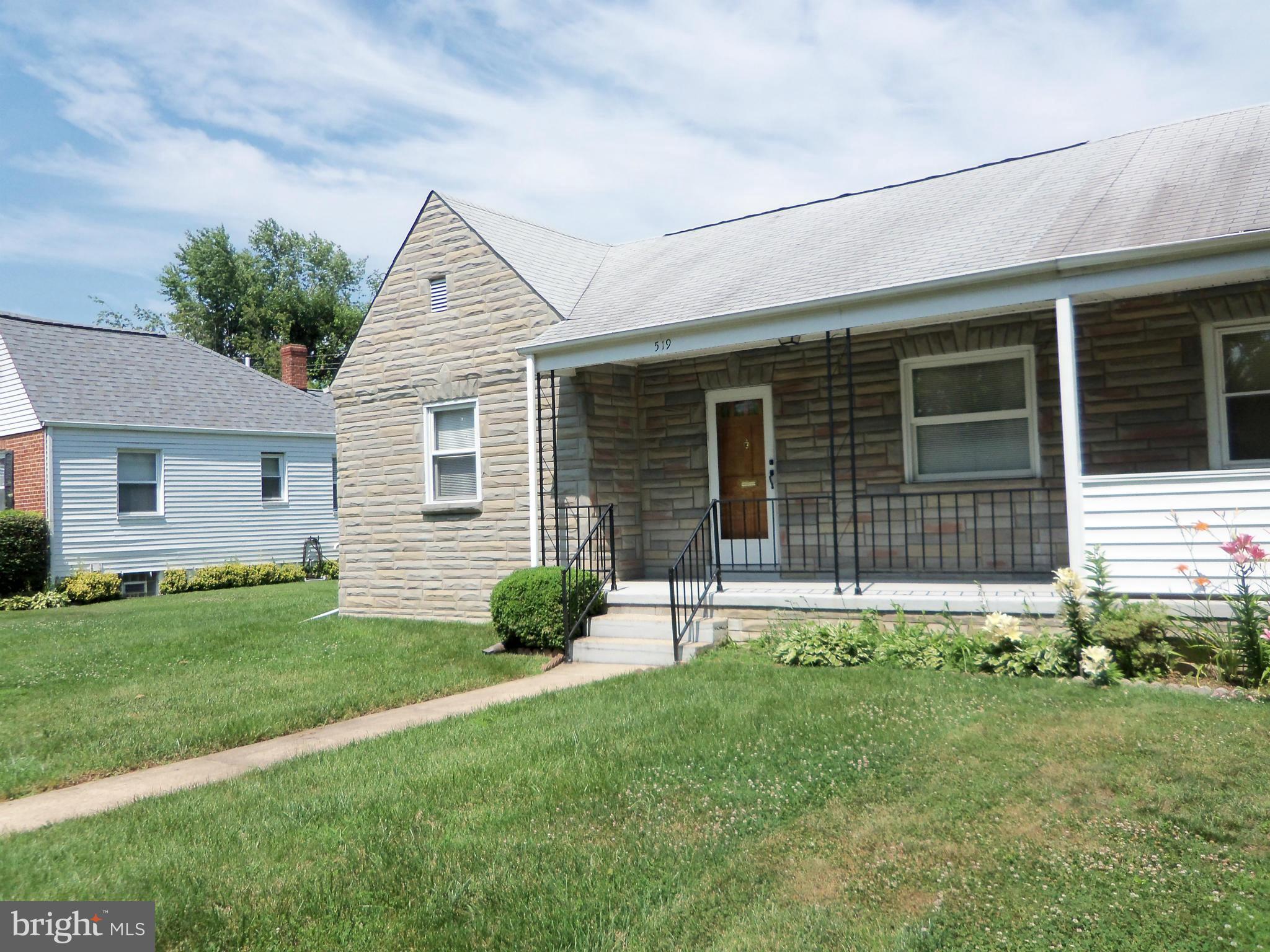519 St Patrick Road Baltimore, MD 21206 - Photo 2 of 19 a front view of a house with a yard and porch