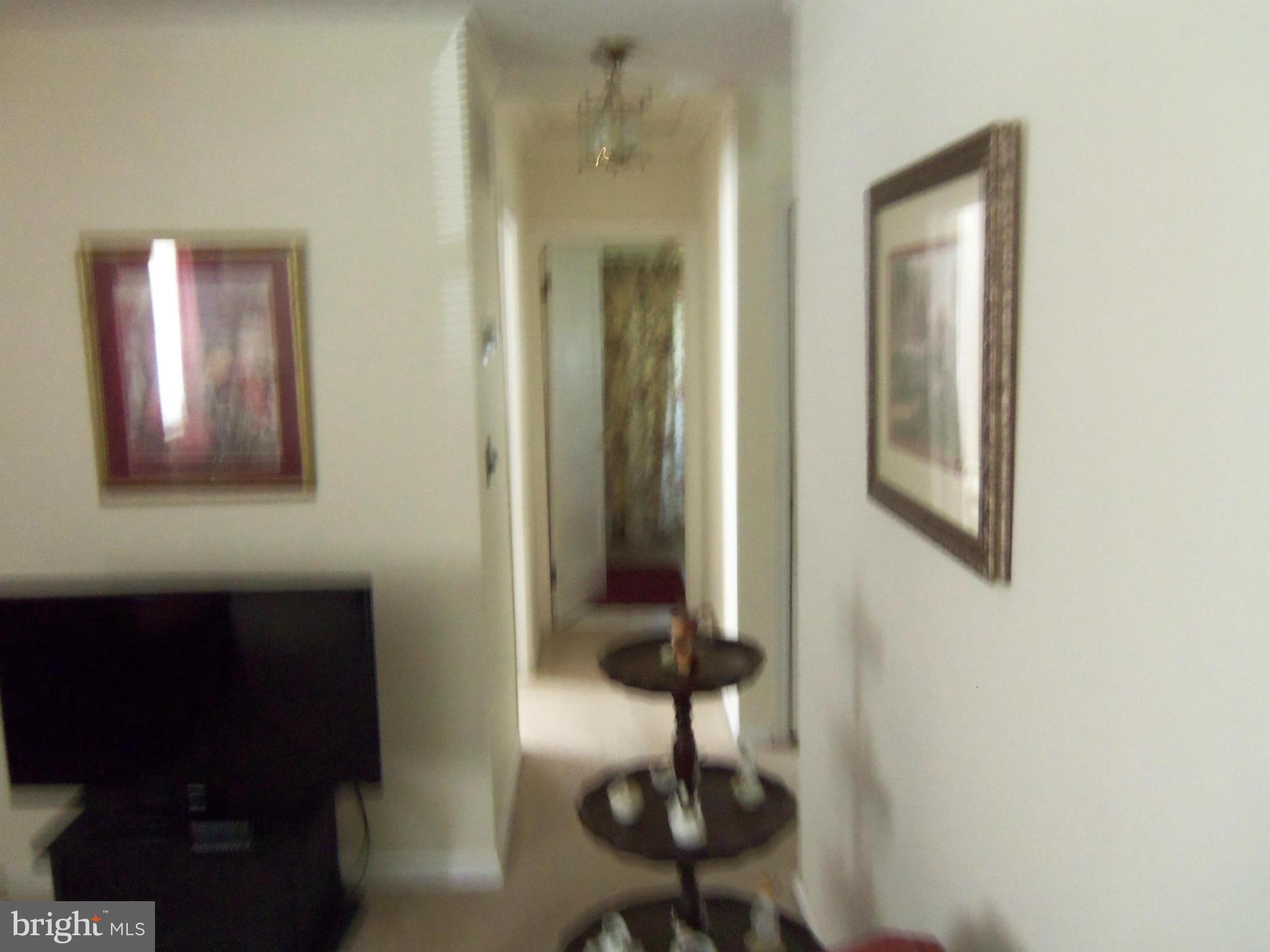 519 St Patrick Road Baltimore, MD 21206 - Photo 11 of 19 a view of a hallway with windows