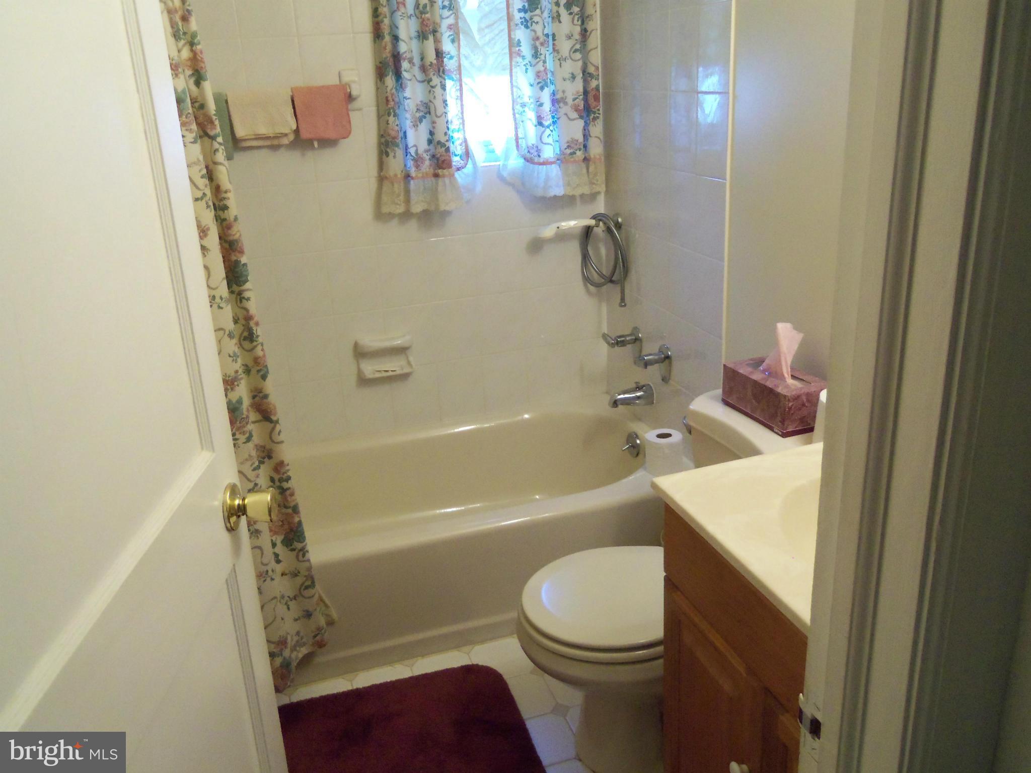 519 St Patrick Road Baltimore, MD 21206 - Photo 12 of 19 a bathroom with a granite countertop sink toilet and shower