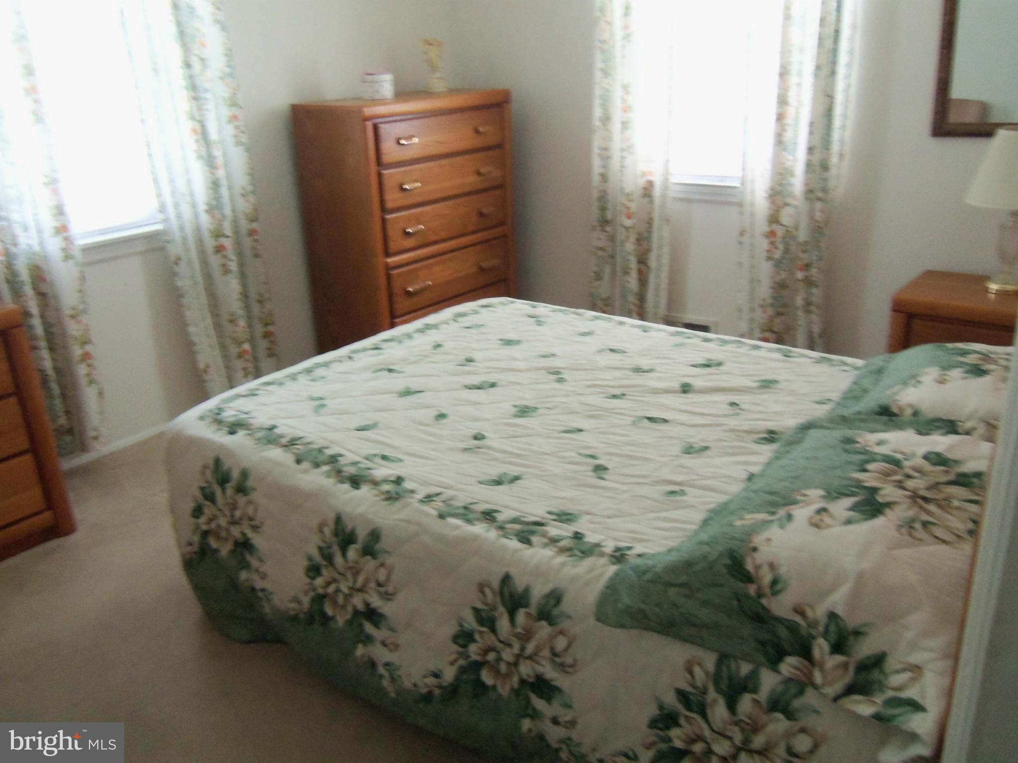 519 St Patrick Road Baltimore, MD 21206 - Photo 9 of 19 a bedroom with a bed and a mirror
