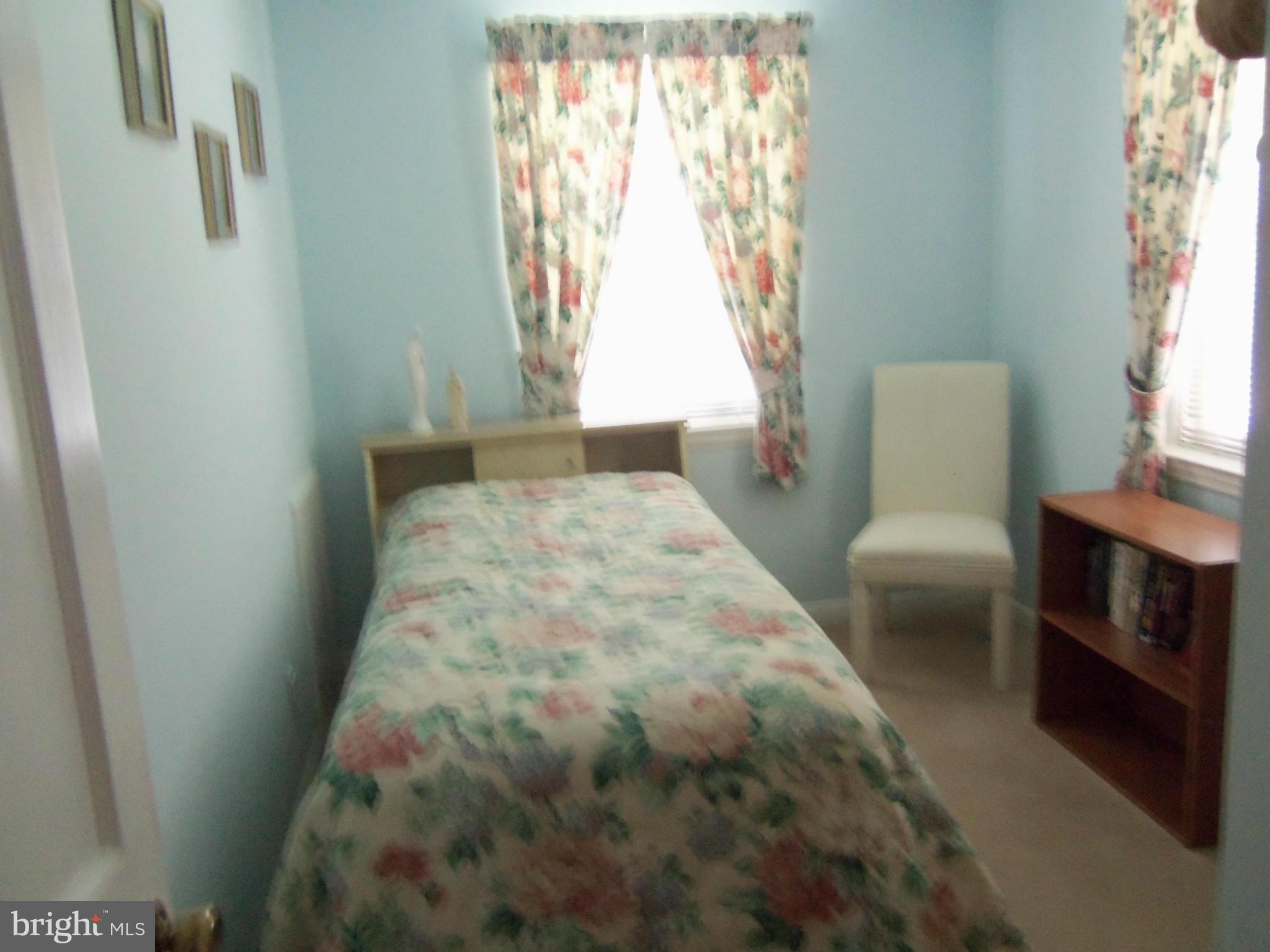 519 St Patrick Road Baltimore, MD 21206 - Photo 10 of 19 a bedroom with a bed and a window