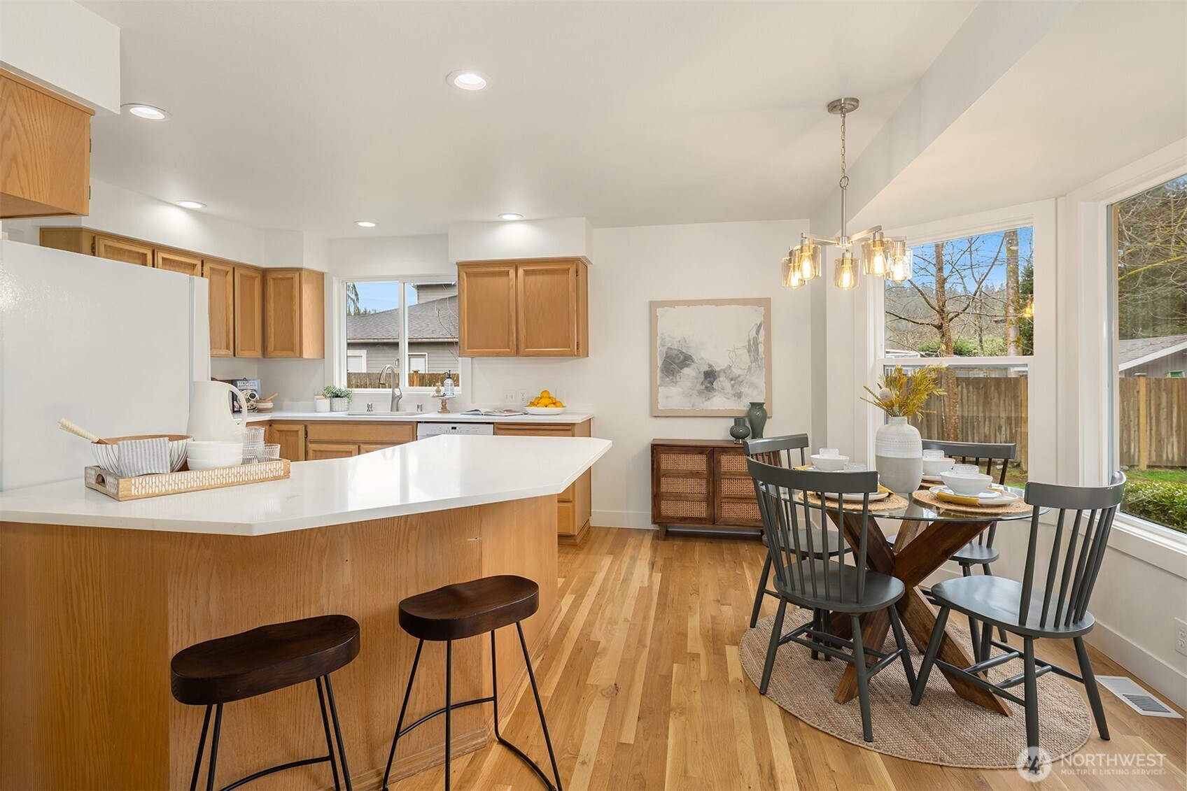 4549 329th Place Southeast Fall City, WA 98024 - Photo 12 of 35 a kitchen with stainless steel appliances kitchen island granite countertop a sink and cabinets