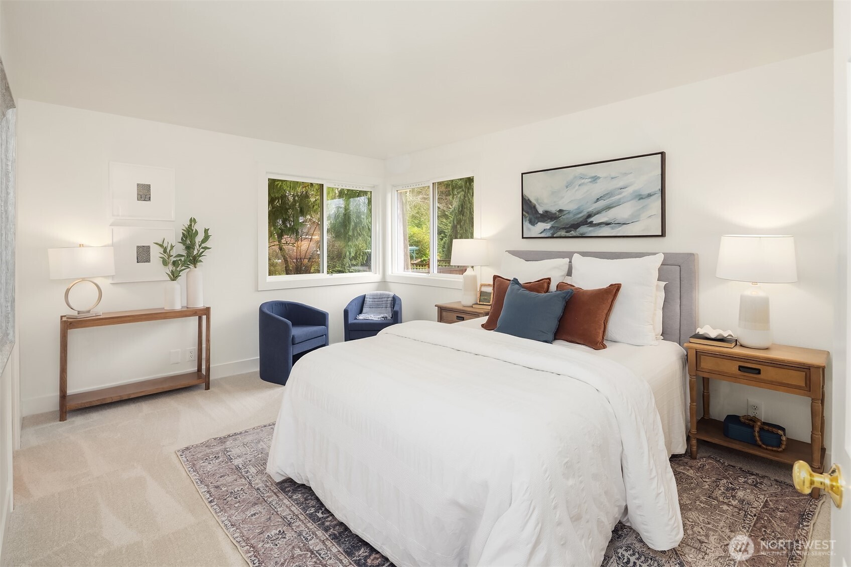 4549 329th Place Southeast Fall City, WA 98024 - Photo 18 of 35 a spacious bedroom with a bed a couch and large window