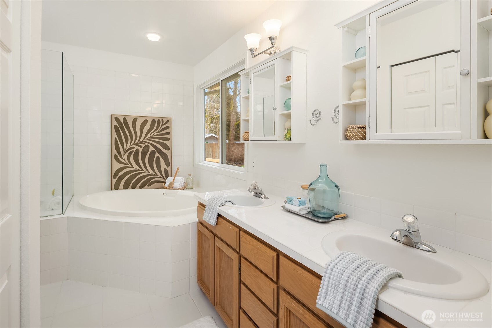 4549 329th Place Southeast Fall City, WA 98024 - Photo 19 of 35 a bathroom with a sink a bathtub and a window