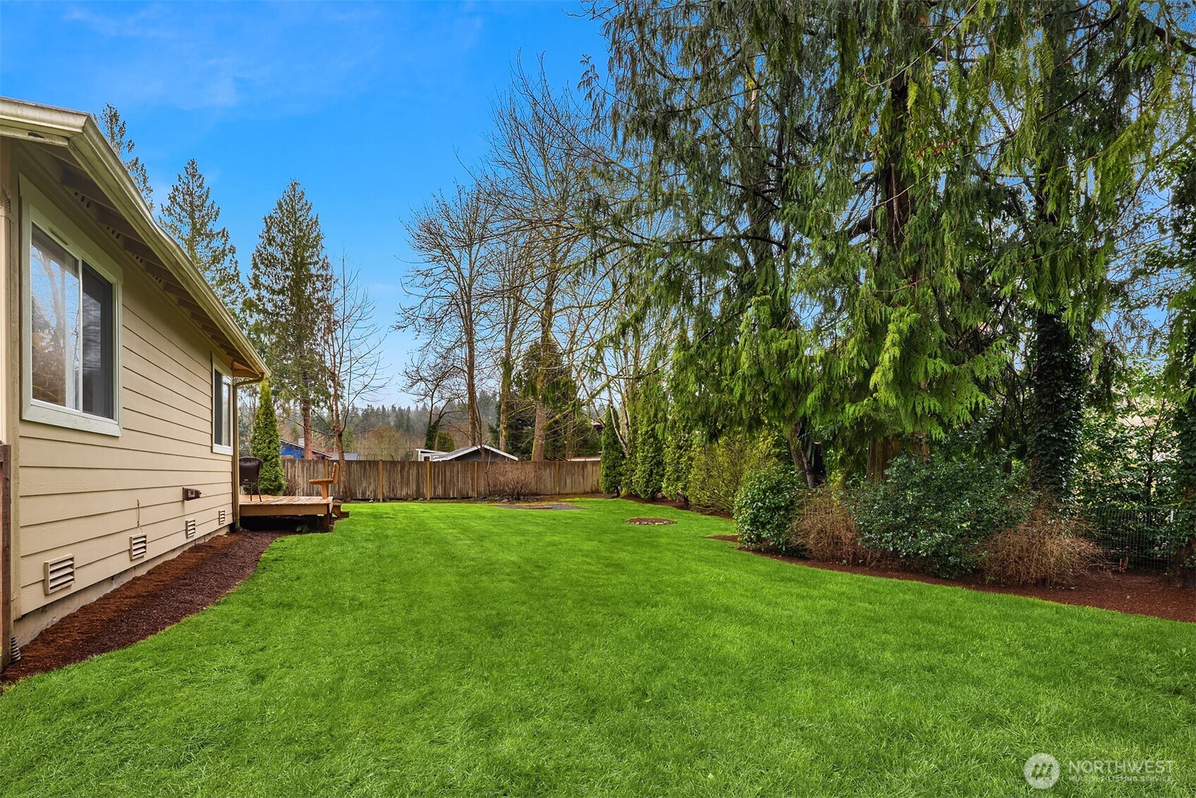 4549 329th Place Southeast Fall City, WA 98024 - Photo 30 of 35 a view of a yard with a house in the background