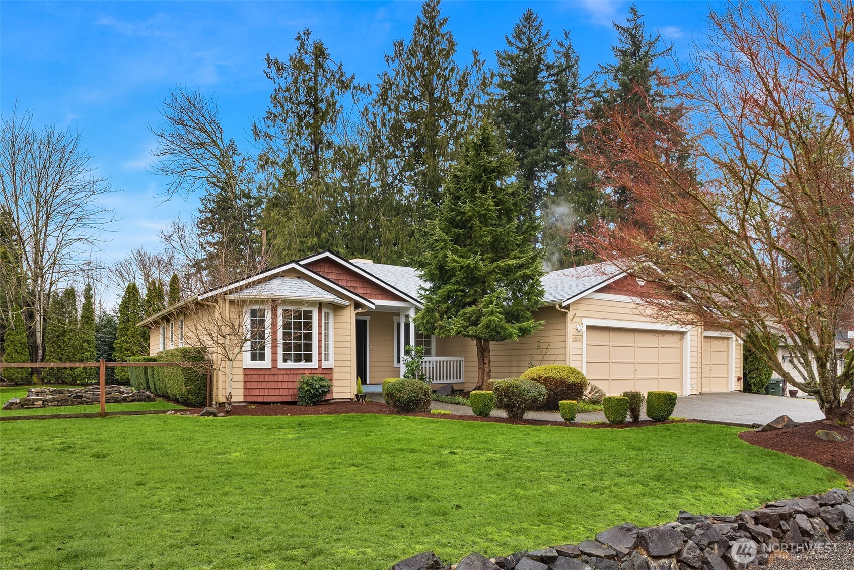 4549 329th Place Southeast Fall City, WA 98024 - Photo 32 of 35 a front view of a house with a garden