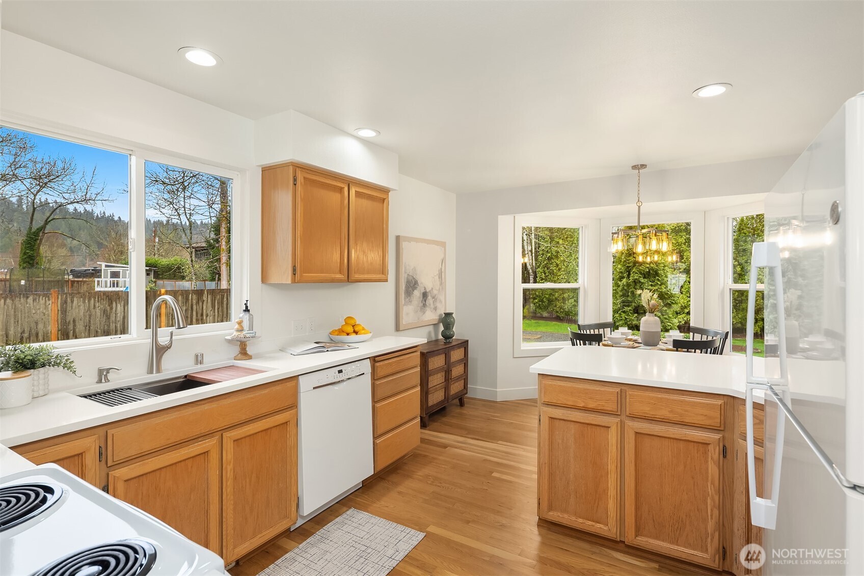 4549 329th Place Southeast Fall City, WA 98024 - Photo 9 of 35 a large white kitchen with a large window