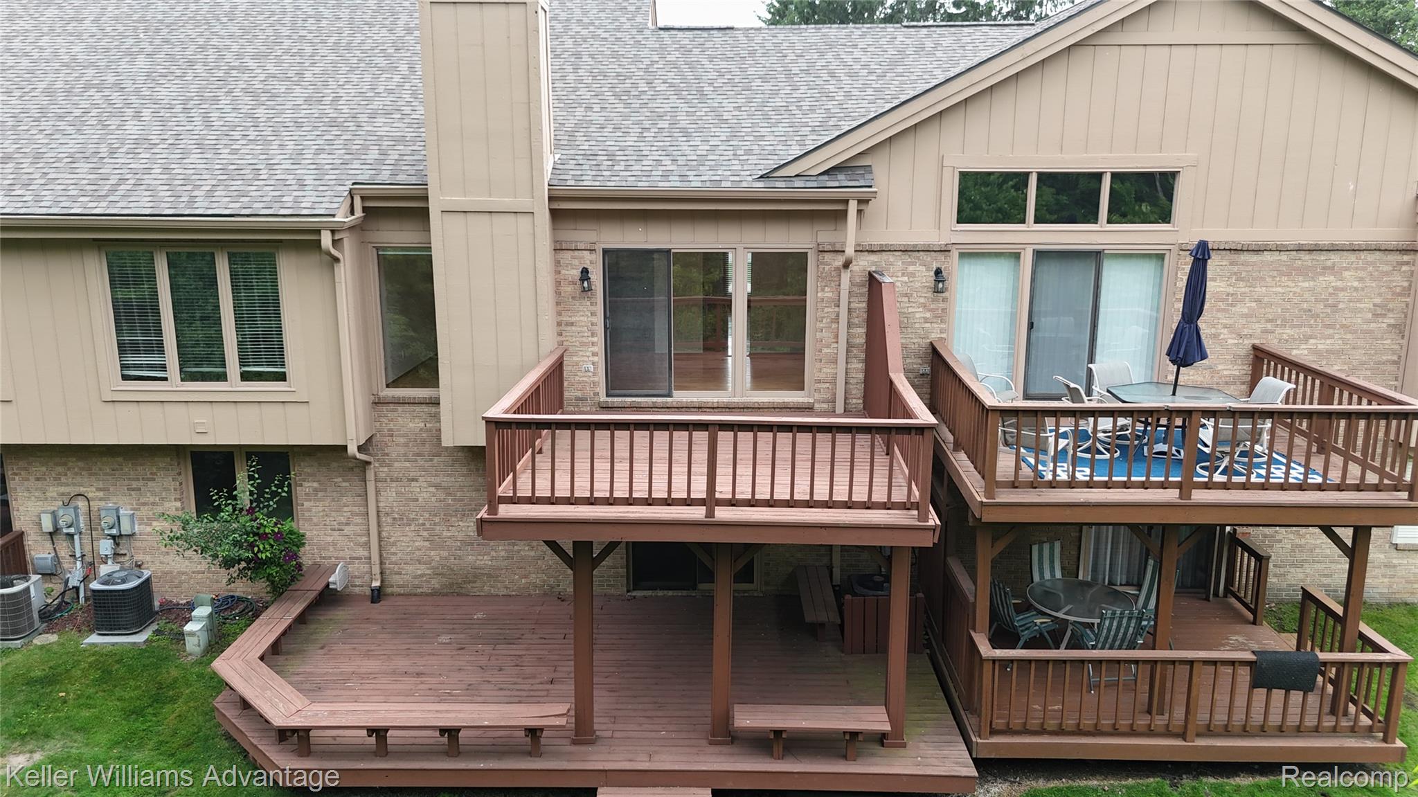 21850 River Ridge Trail Farmington, MI 48335 - Photo 28 of 33 Multi-level deck system featuring a ground-level deck with integrated seating, a mid-level deck, and an upper-level deck