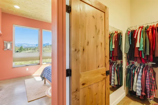 a view of a backyard with plants and outdoor seating