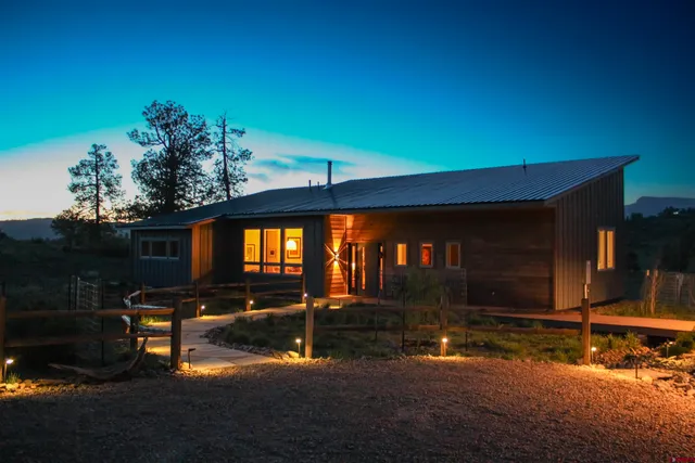 a view of swimming pool with a lounge chairs