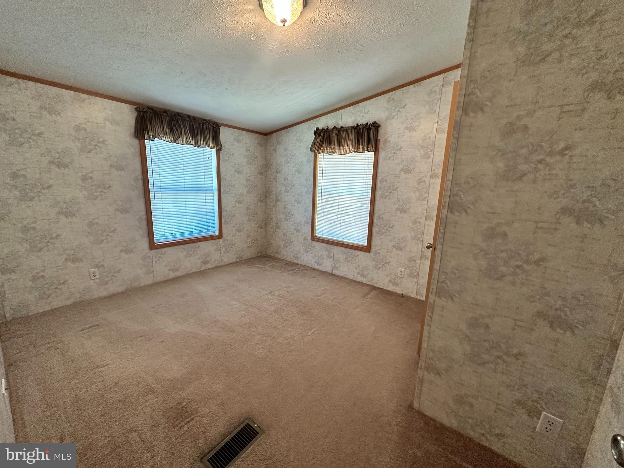 35390 Heron Road Millsboro, DE 19966 - Photo 14 of 25 a view of an empty room with a window
