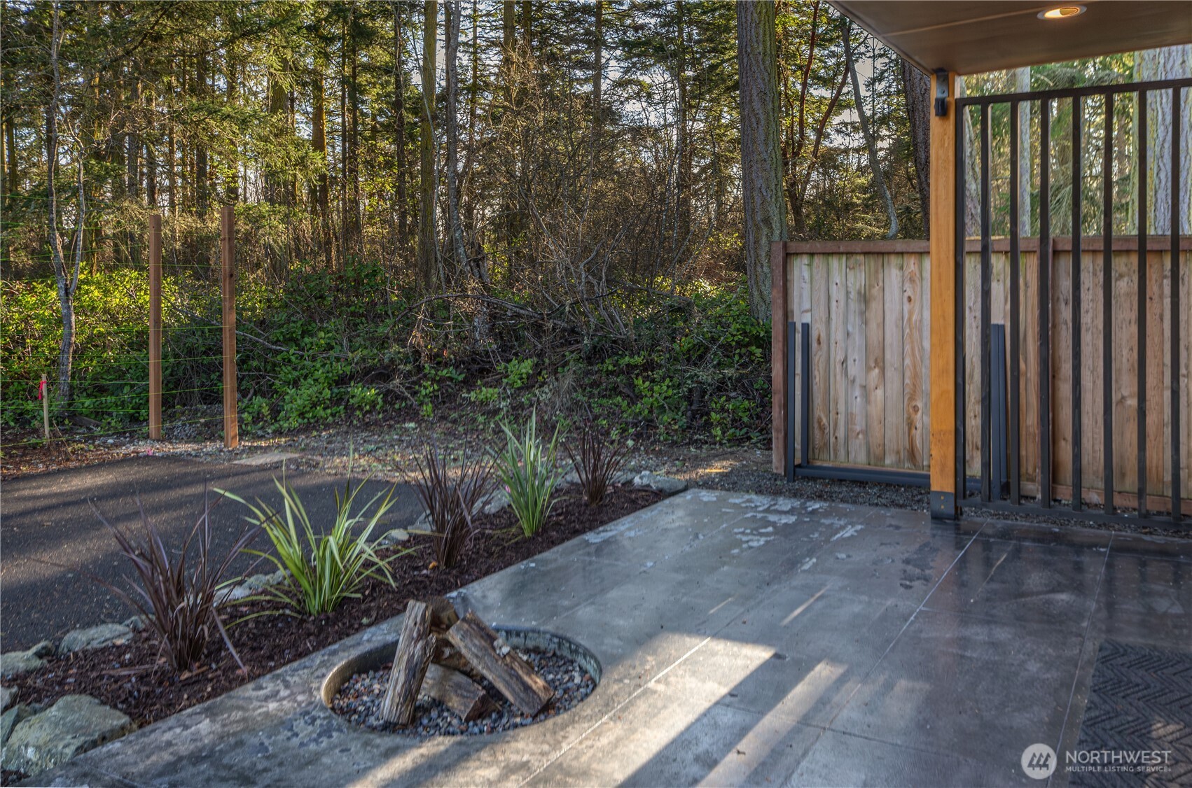 2475 15th Street Port Townsend, WA 98368 - Photo 20 of 27 a view of a backyard with plants and large trees