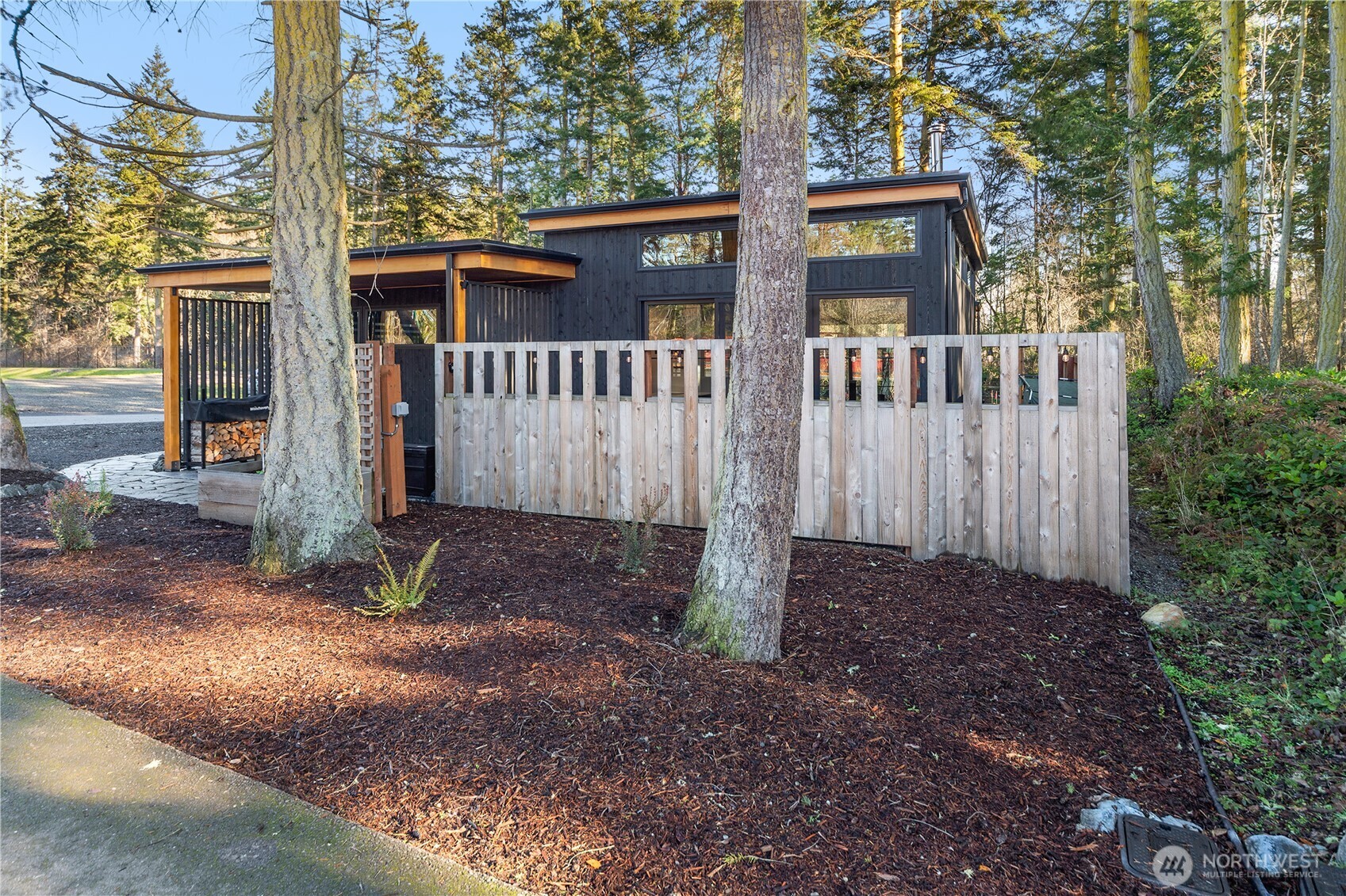2475 15th Street Port Townsend, WA 98368 - Photo 25 of 27 a view of a wooden house with a yard and large tree