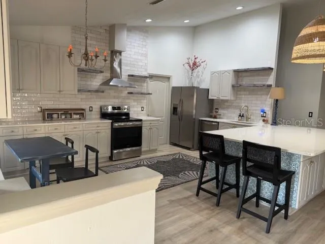 a bedroom with wooden floor closet and a ceiling fan