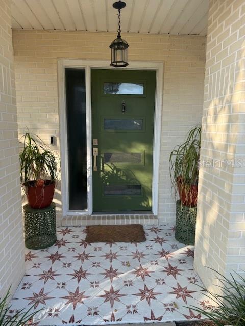 7 Federal Lane Palm Coast, FL 32137 - Photo 3 of 59 a view of a entryway door front of house