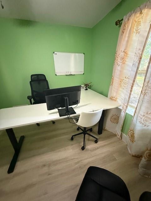 7 Federal Lane Palm Coast, FL 32137 - Photo 39 of 59 a workspace with furniture and a wooden floor