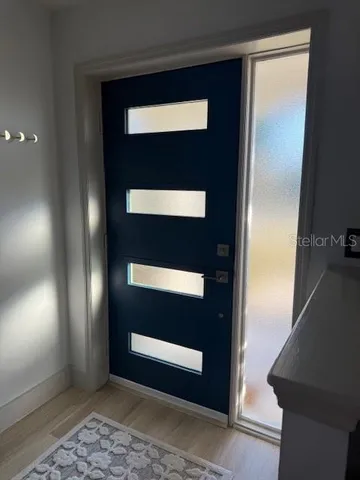 a view of a livingroom with furniture and window