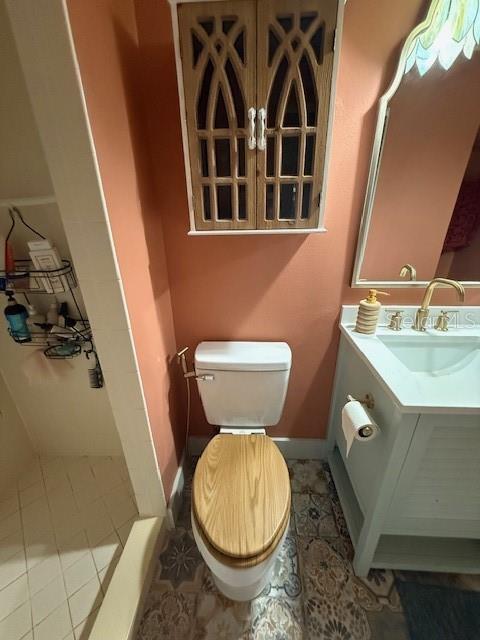 7 Federal Lane Palm Coast, FL 32137 - Photo 49 of 59 a bathroom with a toilet and a sink