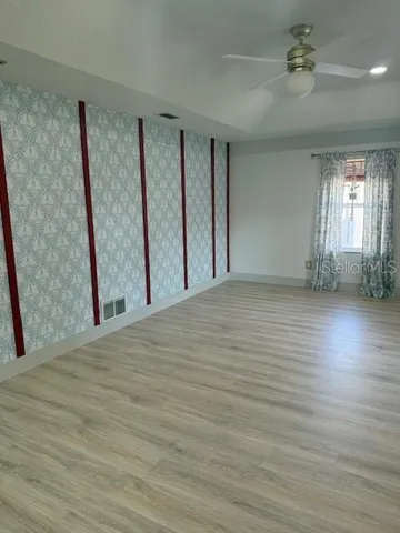 a view of a kitchen with a table and chairs