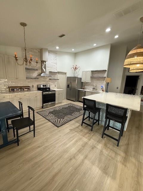 7 Federal Lane Palm Coast, FL 32137 - Photo 10 of 59 a living room with stainless steel appliances kitchen island granite countertop furniture and a wooden floor