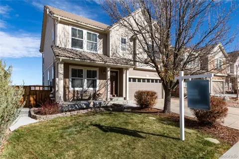 a house view with a sitting space and garden space