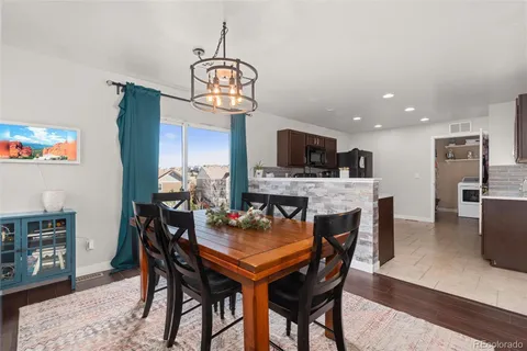 a kitchen with cabinets stainless steel appliances and a sink