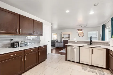 a kitchen with a sink and cabinets