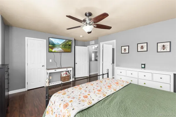 a bedroom with a bed and a dresser