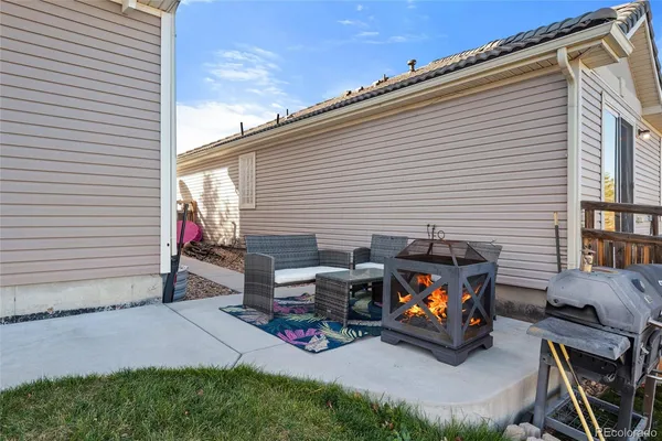 a view of a patio with a chairs and a table