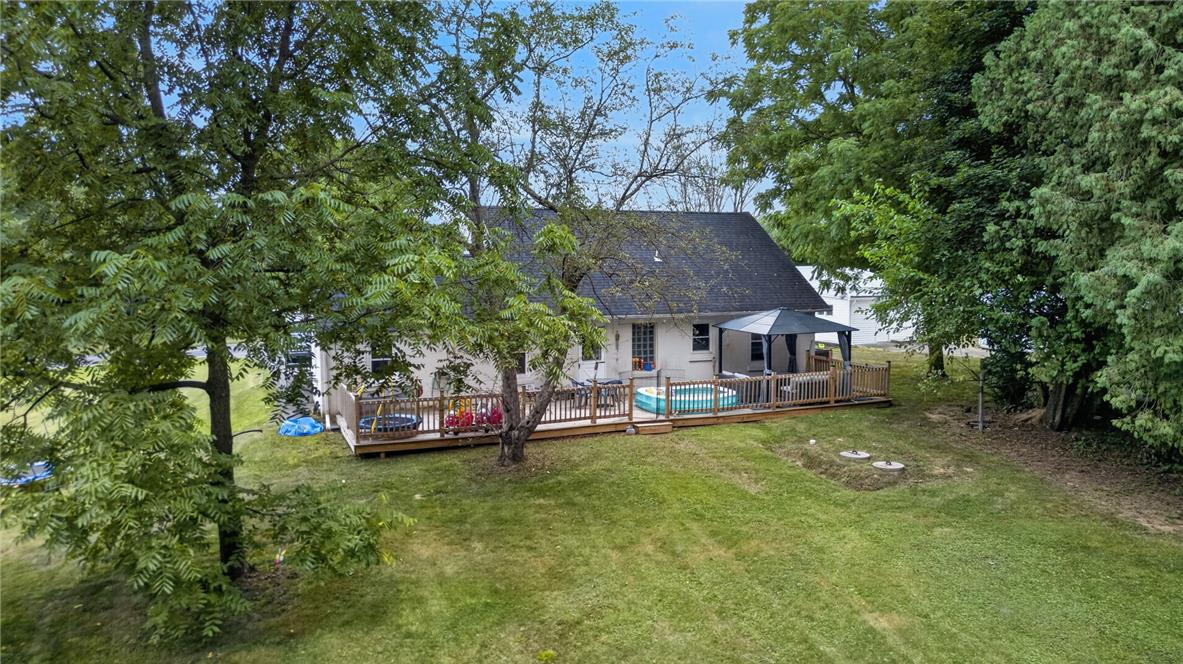 3123 Orefield Road Allentown, PA 18104 - Photo 6 of 39 A spacious backyard with an elevated wooden deck, perfect for outdoor enjoyment and relaxation.