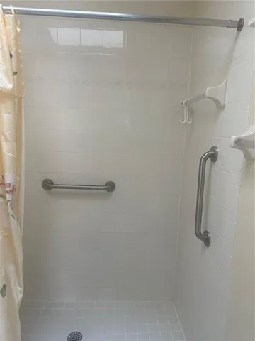 a white toilet sitting next to a bathroom sink