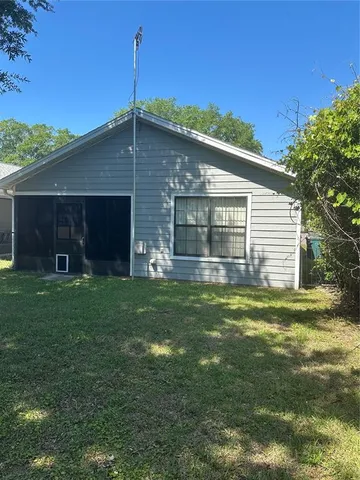 a view of an empty room and a window