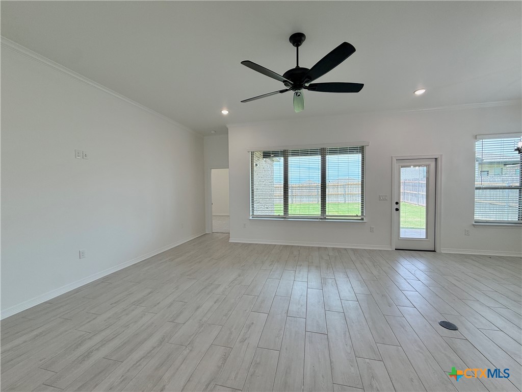2016 Yarrow Road Temple, TX 76502 - Photo 5 of 30 an empty room with wooden floor fan and windows