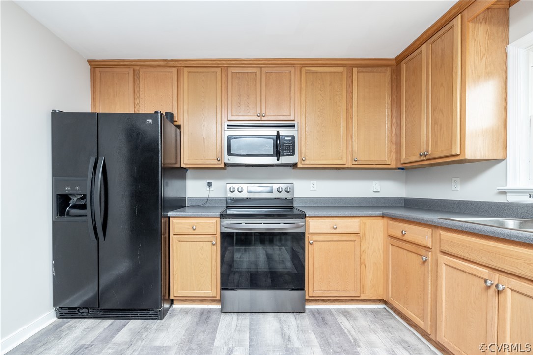 7737 Drexelbrook Road Chesterfield, VA 23832 - Photo 12 of 39 a kitchen with granite countertop wooden cabinets and stainless steel appliances