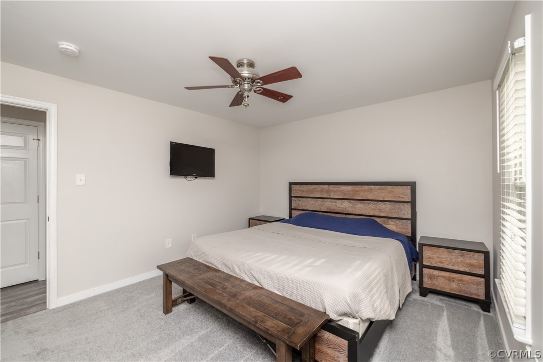 7737 Drexelbrook Road Chesterfield, VA 23832 - Photo 16 of 39 a bedroom with a bed and a flat screen tv