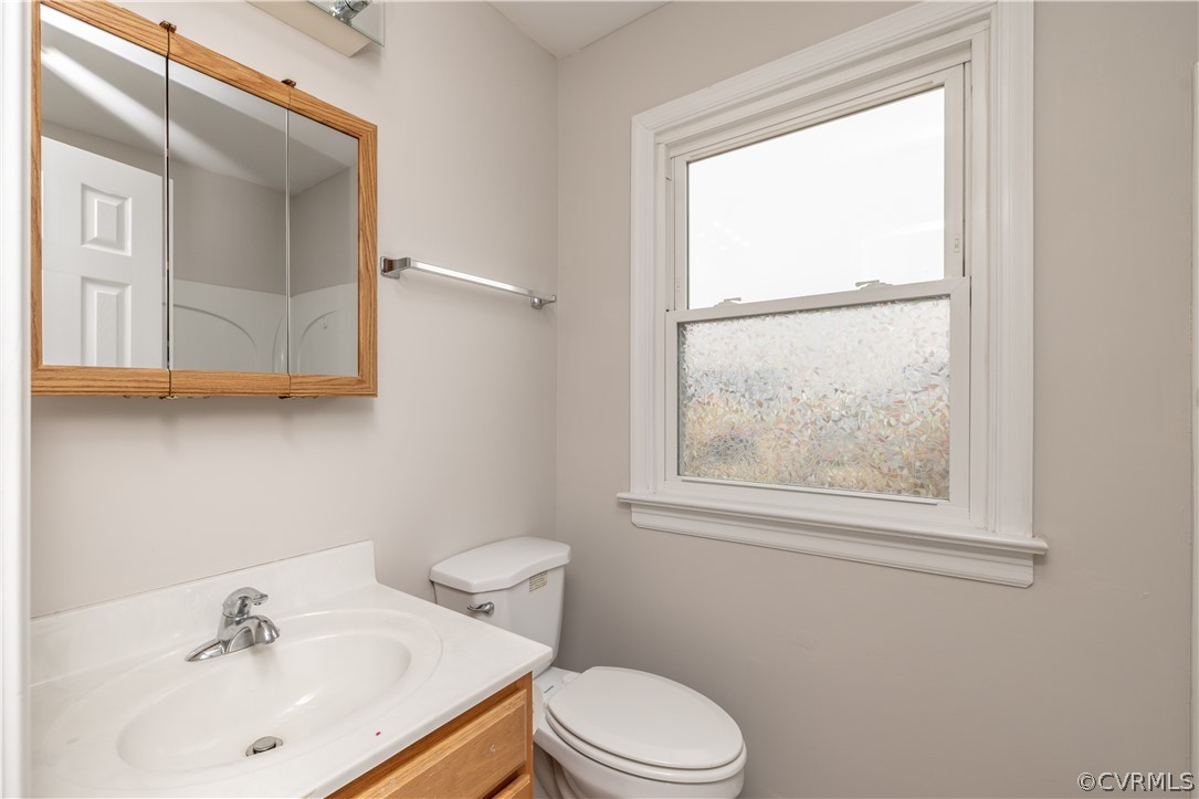7737 Drexelbrook Road Chesterfield, VA 23832 - Photo 27 of 39 a bathroom with a sink vanity mirror and toilet
