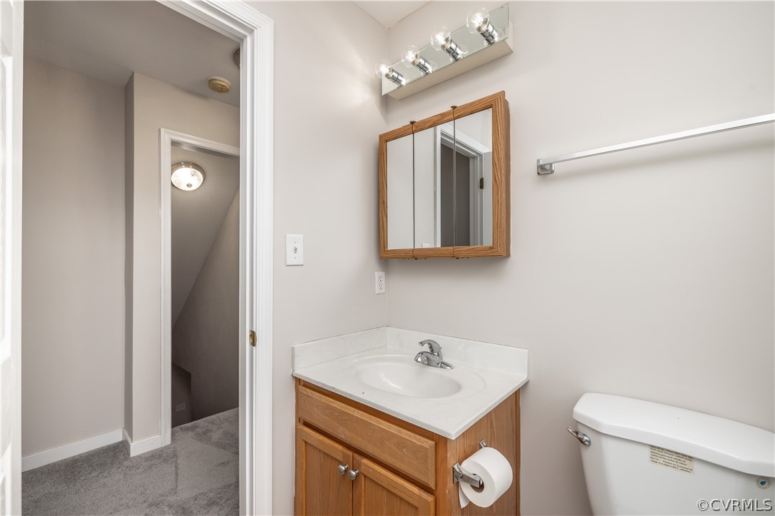 7737 Drexelbrook Road Chesterfield, VA 23832 - Photo 28 of 39 a bathroom with a toilet sink and mirror