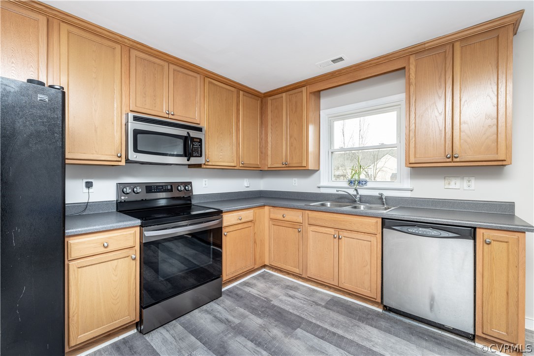 7737 Drexelbrook Road Chesterfield, VA 23832 - Photo 10 of 39 a kitchen with granite countertop cabinets stainless steel appliances a sink and a window