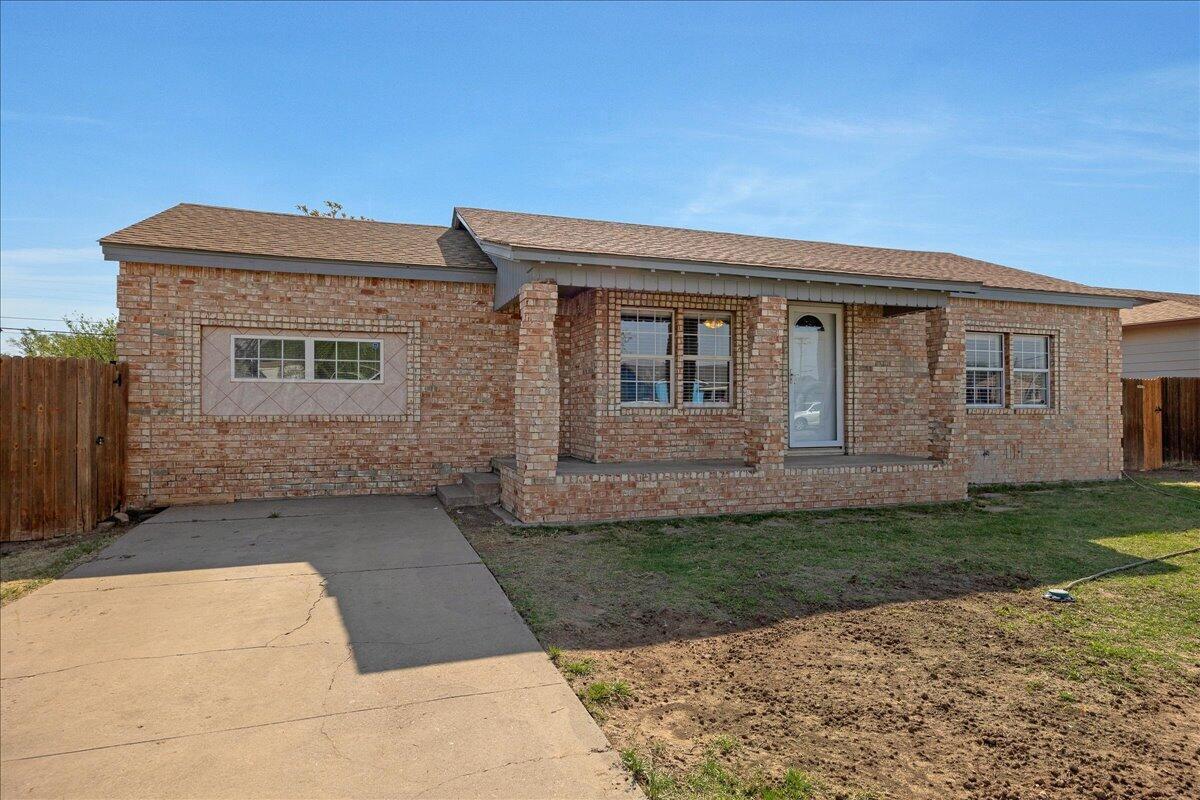 1504 Birch Street Amarillo, TX 79107 - Photo 2 of 19 a front view of a house with a yard