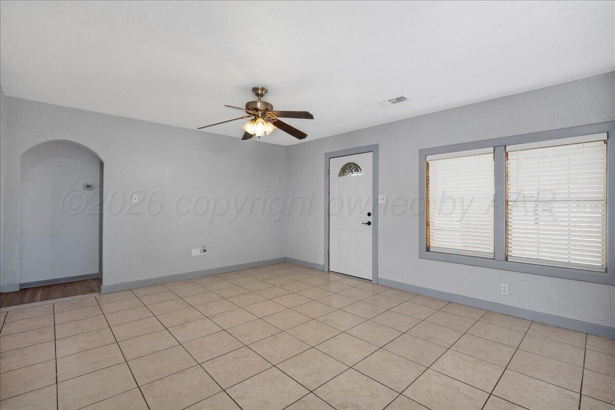1504 Birch Street Amarillo, TX 79107 - Photo 3 of 19 a view of an empty room with a window