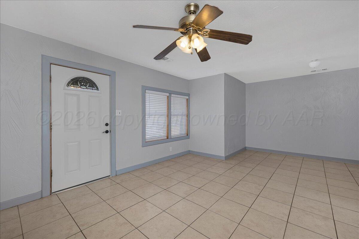 1504 Birch Street Amarillo, TX 79107 - Photo 4 of 19 a view of an empty room with chandelier fan