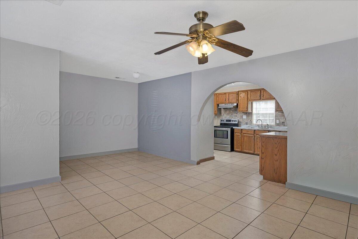 1504 Birch Street Amarillo, TX 79107 - Photo 5 of 19 a view of a kitchen with microwave and cabinets