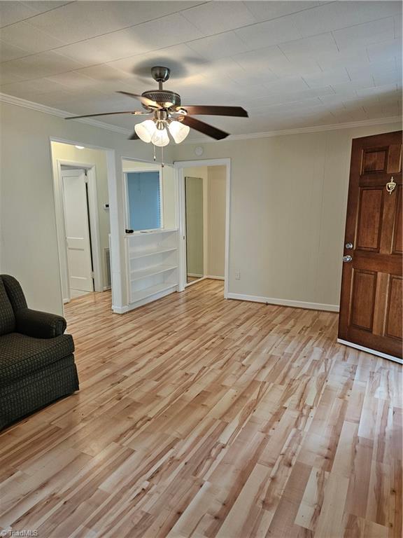 141 Roberts Road Eden, NC 27288 - Photo 8 of 15 Living room with front door….nice built in bookcase and doorway to bedroom